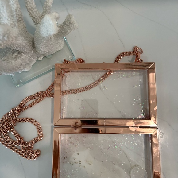 Clear purse with Rose colored trim. - Picture 2 of 2